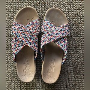 Criss cross wedge slide sandal by Sketchers